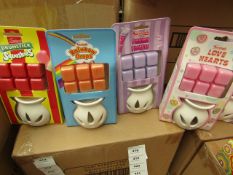 4x Various Swizzels scented wax burners, 1x Drumstick Squashies, 1x Parma Violets, 1x Rainbow