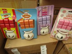 4x Various Swizzels scented wax burners, 1x Drumstick Squashies, 1x Parma Violets, 1x Rainbow