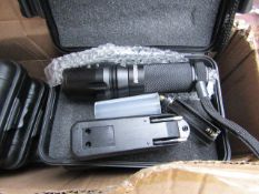 Shadow Hawk flashlight and rechargeable battery with charger, untested in case.