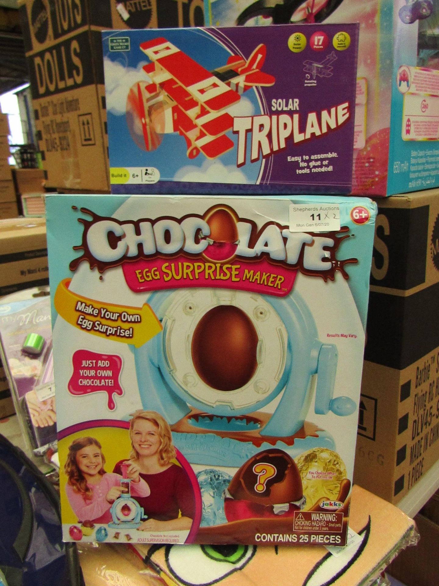 2 items being 1 x Chocolate Egg Surprise Maker packaged & 1 x Solar Triplane packaged