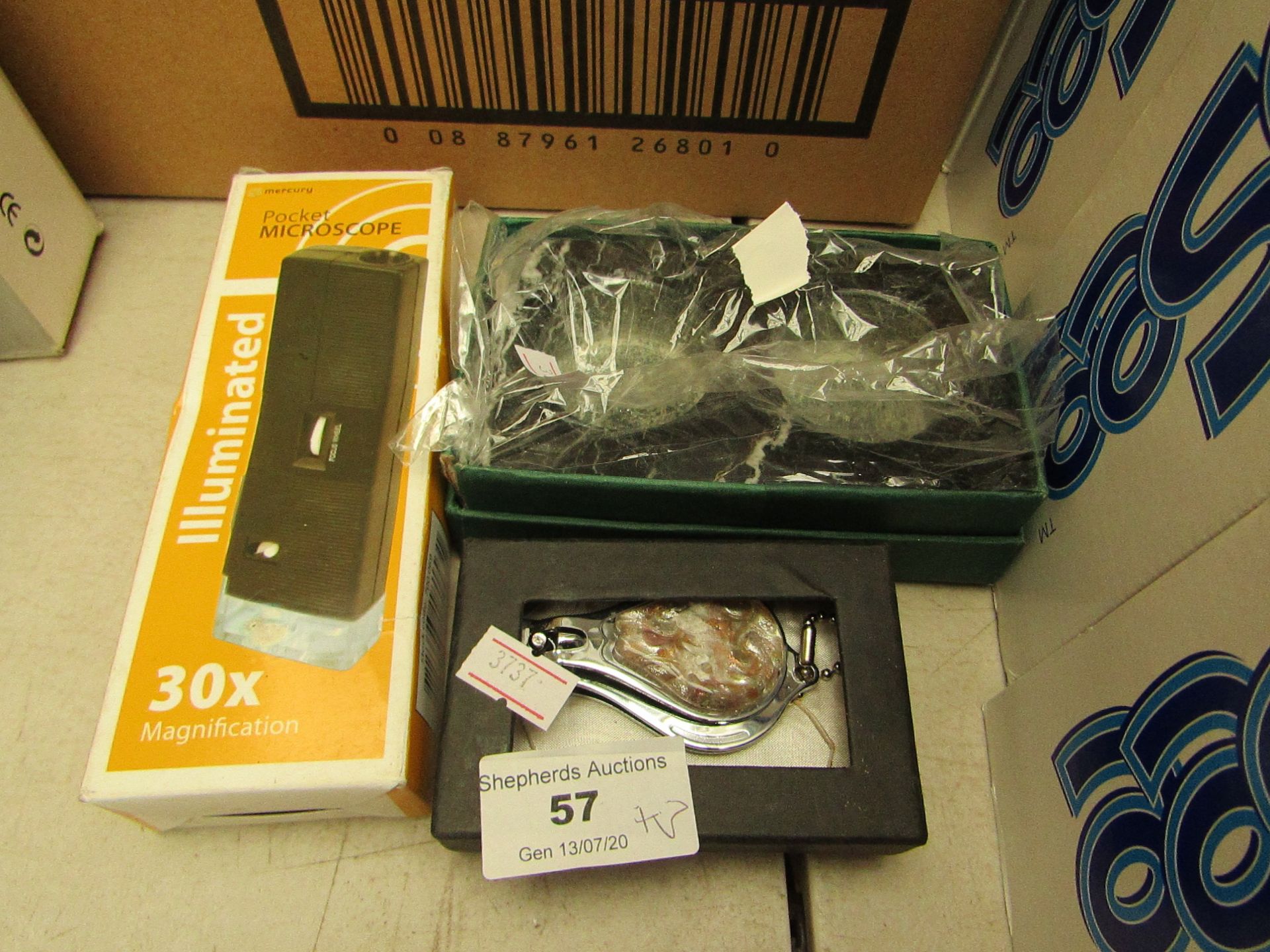 3 items being 1 x Pocket Microscope, 1 x Nail Clipper/Bottle Opener, Double tea Light Holder boxed