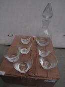 7 Piece drink set containing; a decanter and 6x small glasses.