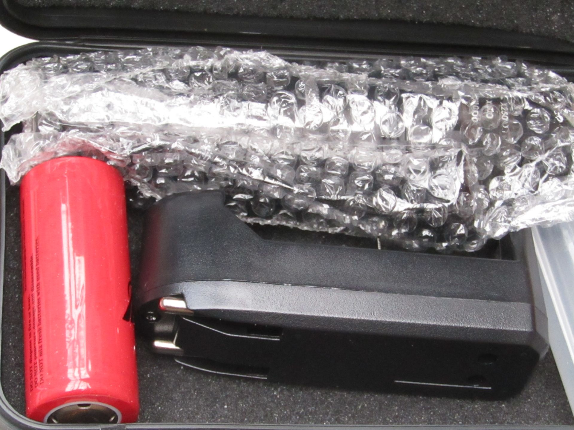 Shadow Hawk flashlight and rechargeable battery with charger, untested in case.