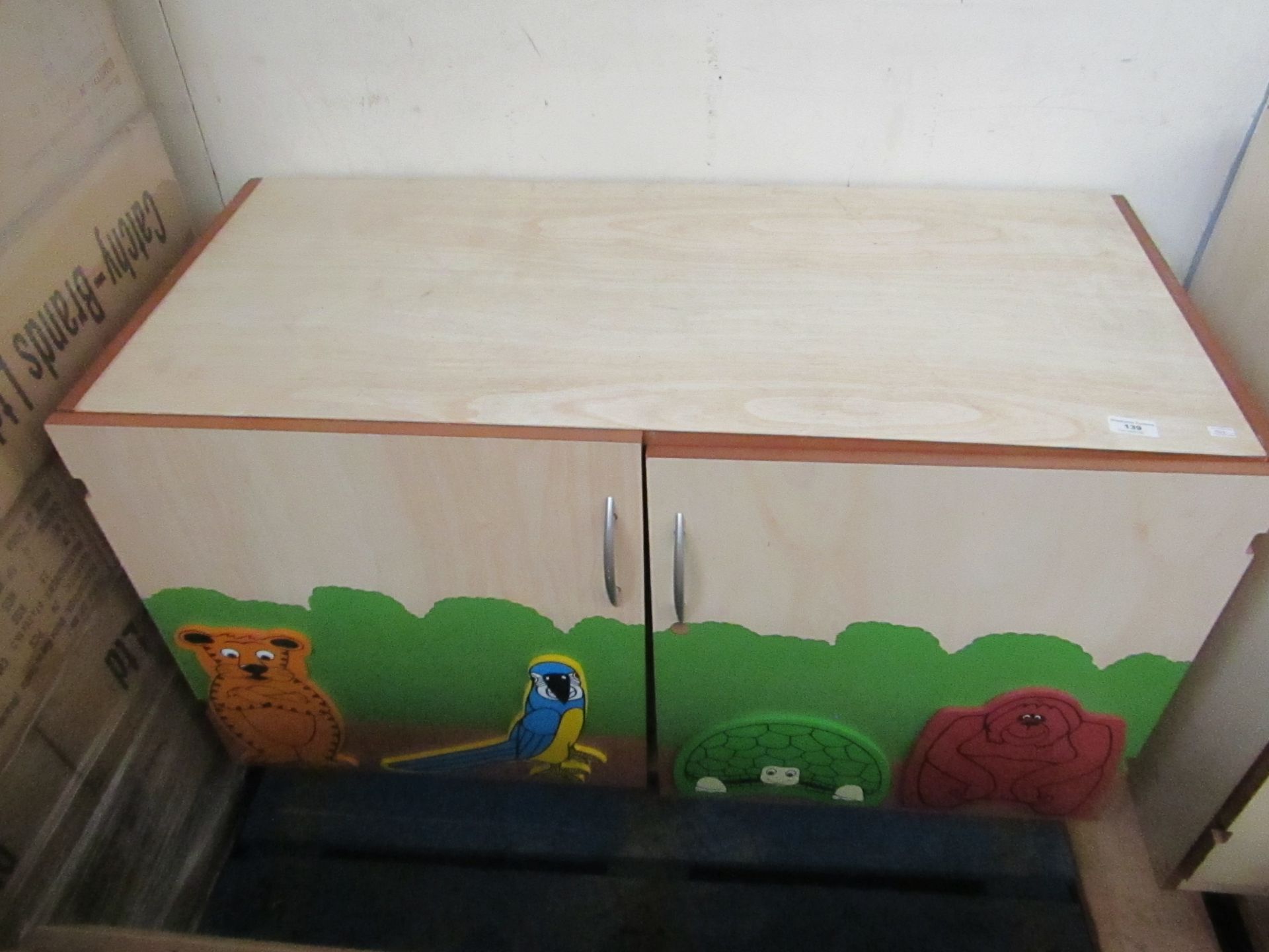 2 Door Cupboard removed from a Nursery, used with all the loving marks of a Nursery