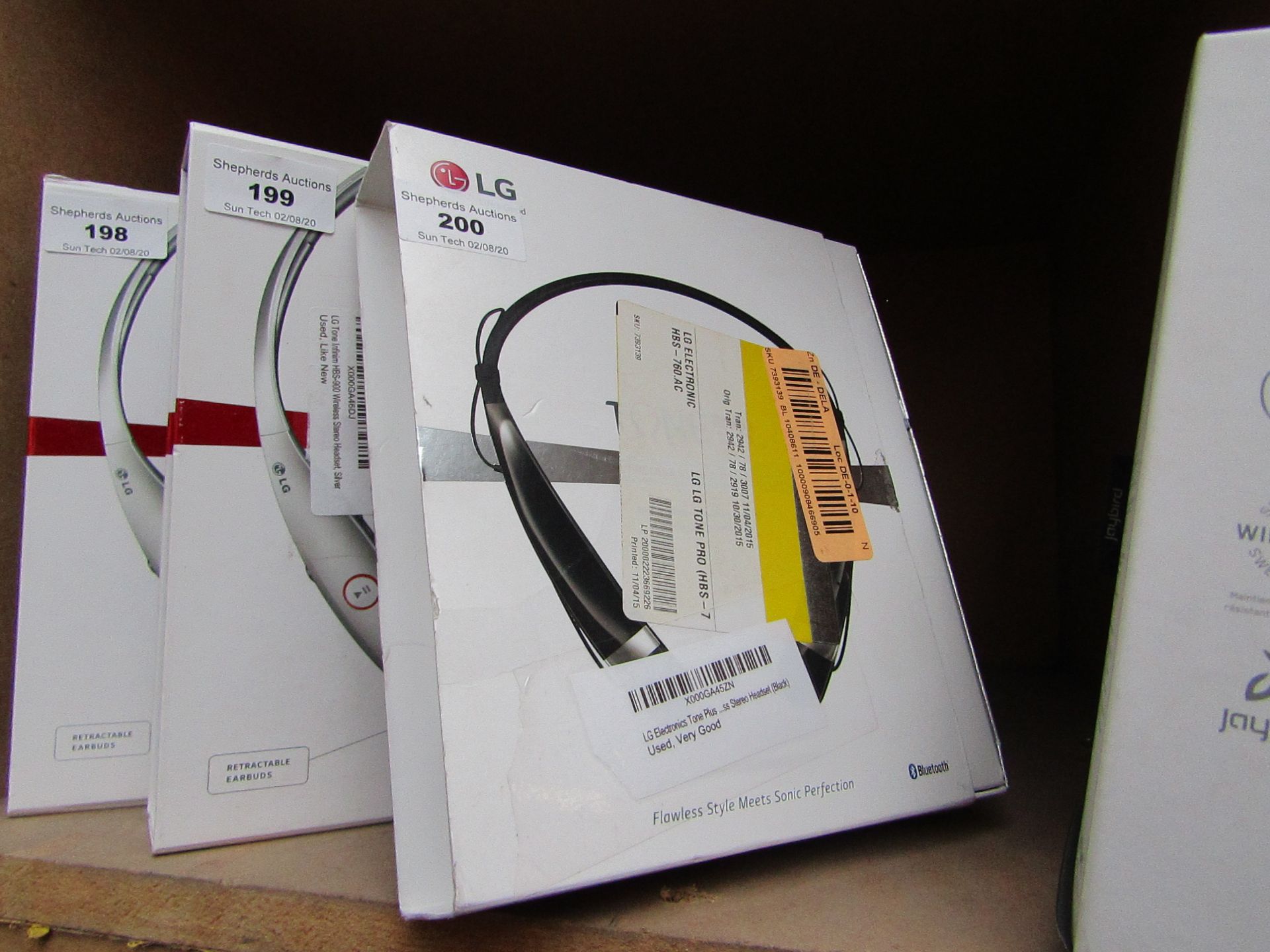 LG Tone Plus earphones, untested and boxed.