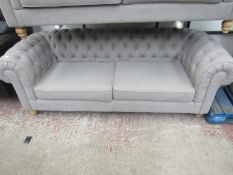 Chesterfield style 2 seater button back sofa, is a bit bobbly in places.