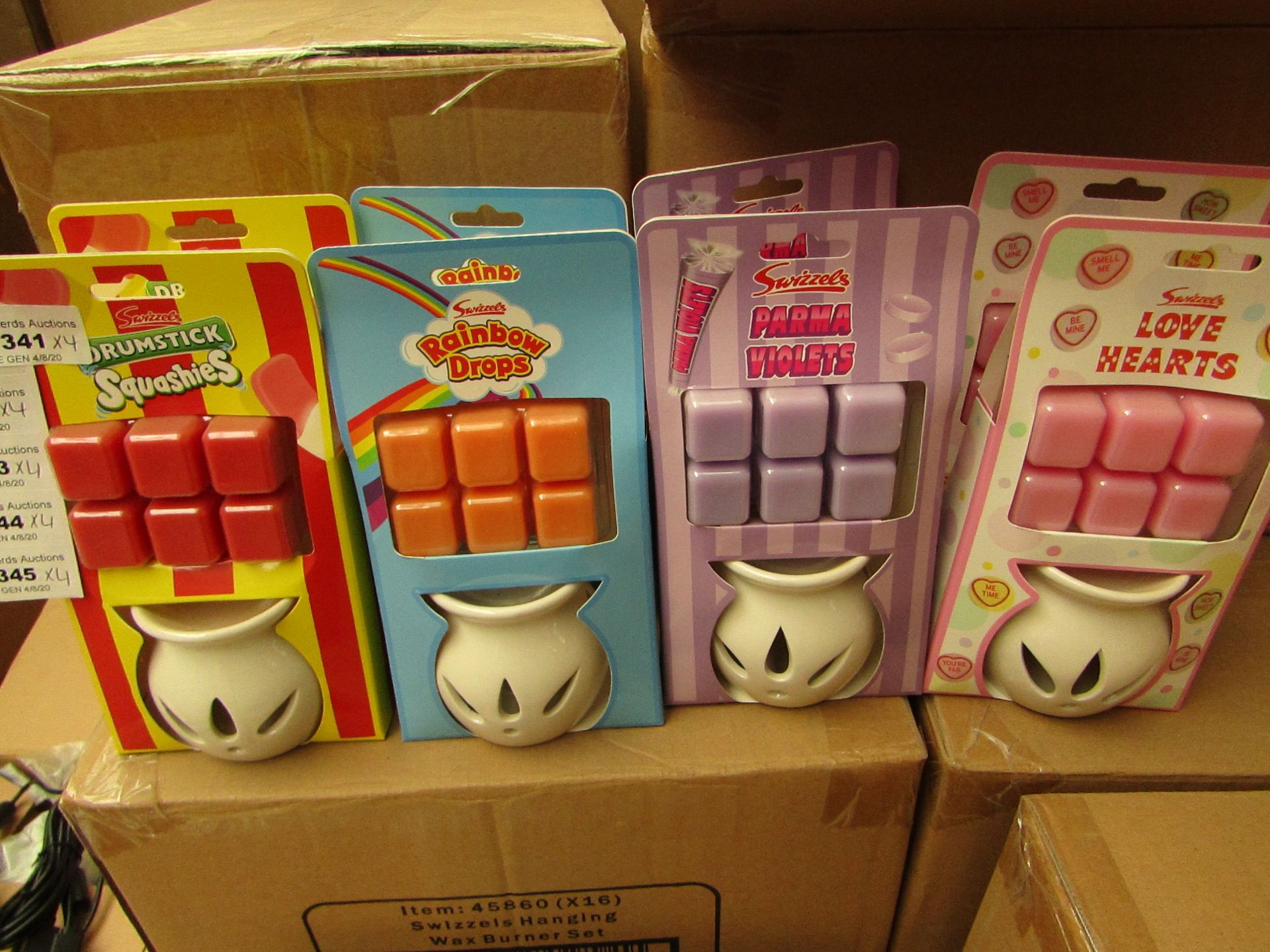 16 x Swizzles Wax Melt Burners with melts. 4 x Drumstick Squashies, 4 x Rainbow Drops, 4 x Parma