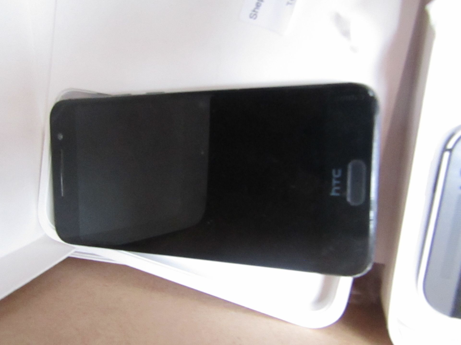 HTC One (M8) CDMA phone, no power. Boxed. Estimated specs at https://www.gsmarena.com/htc_one_(m8)