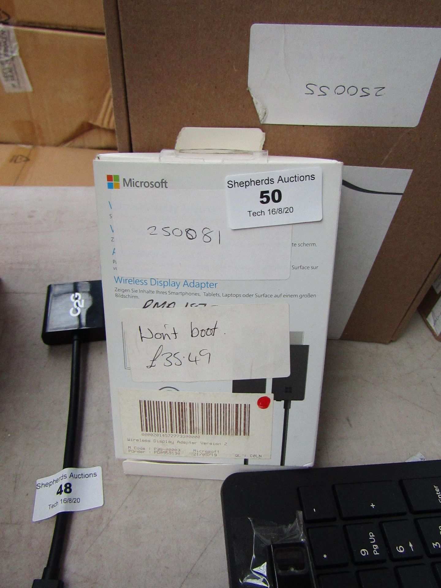 Microsoft wireless display adaptor, unchecked and boxed.