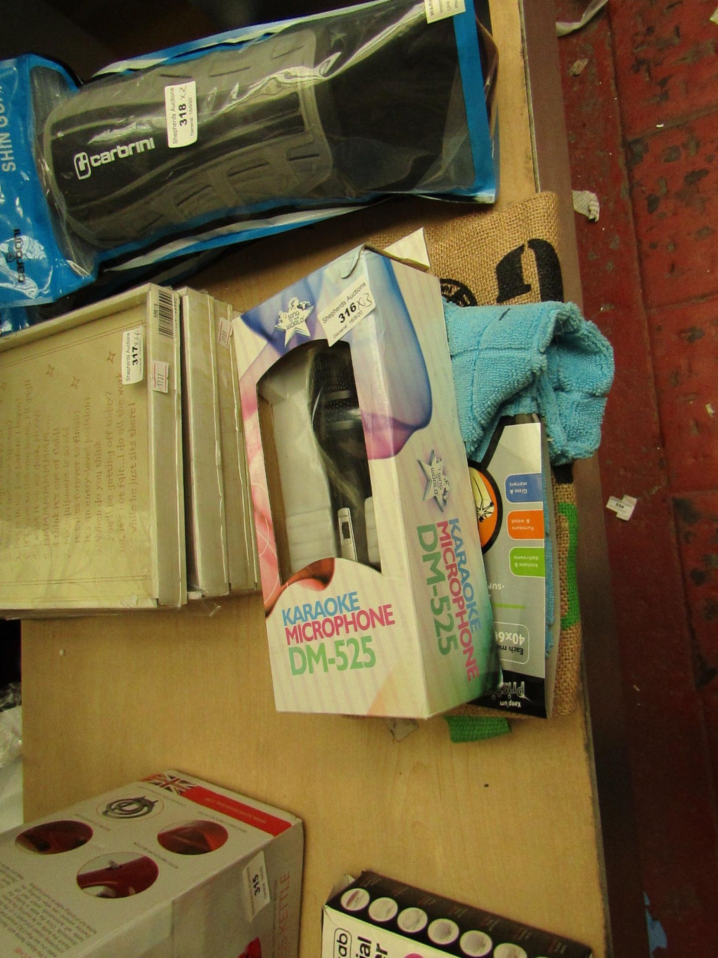 3 Items Being a Karaoke Microphone DM-525, A Cleaning Cloth & an Organic Shopping Bag.