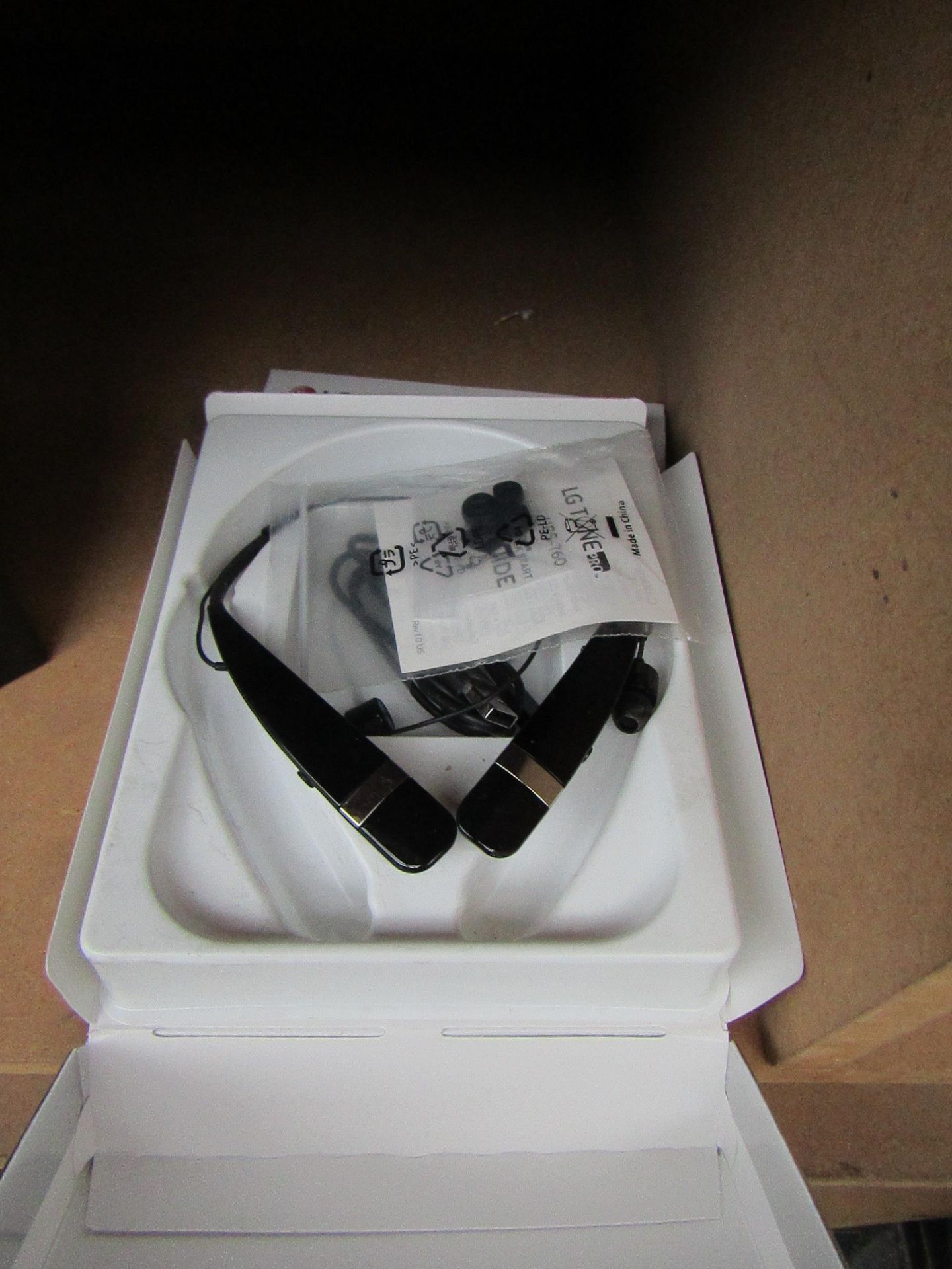 LG Tone Plus earphones, untested and boxed.