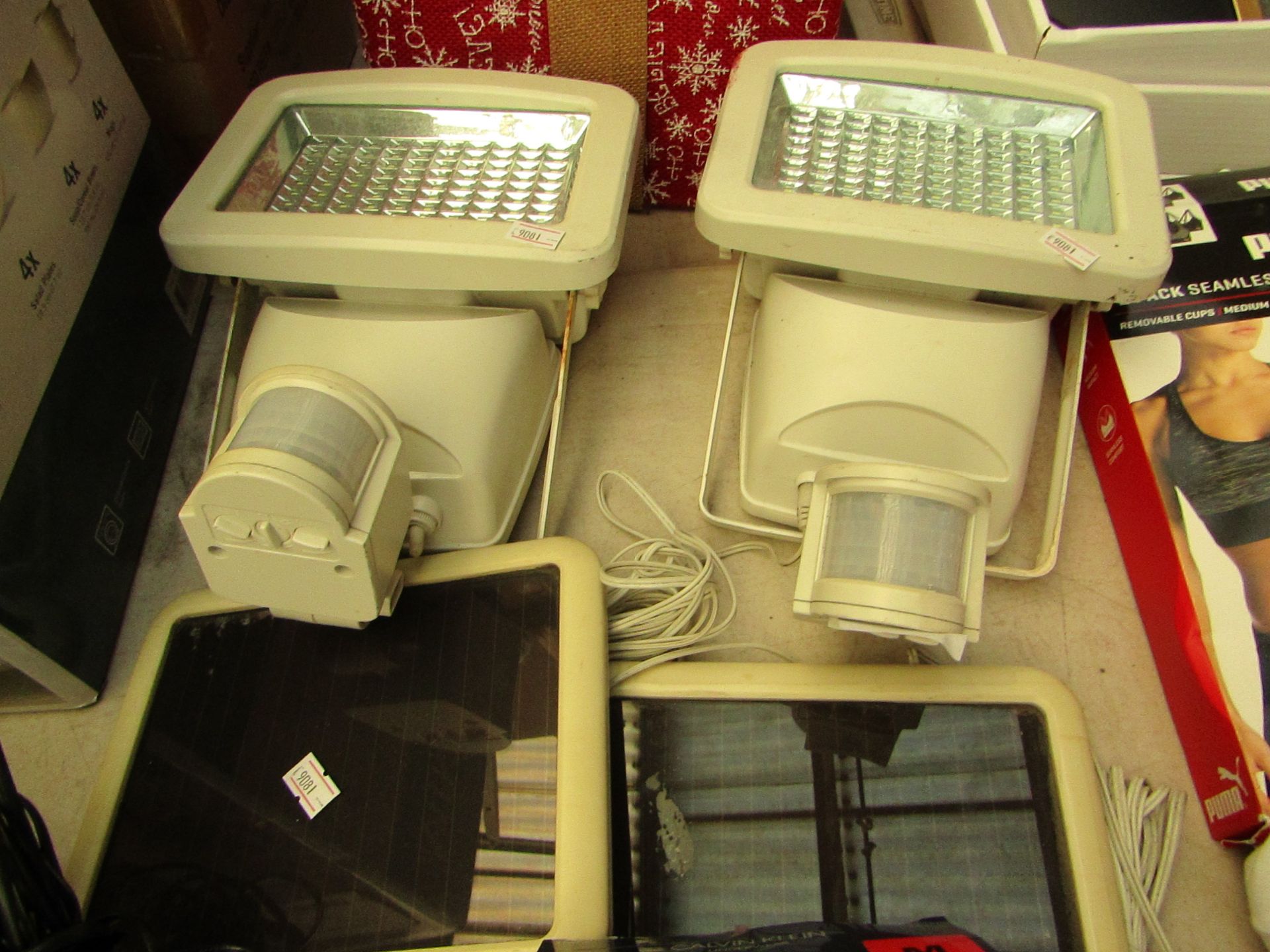 2 x Sloar outdoor Lights. Theses have been well used.180 lED's in each with Motion Sensors.