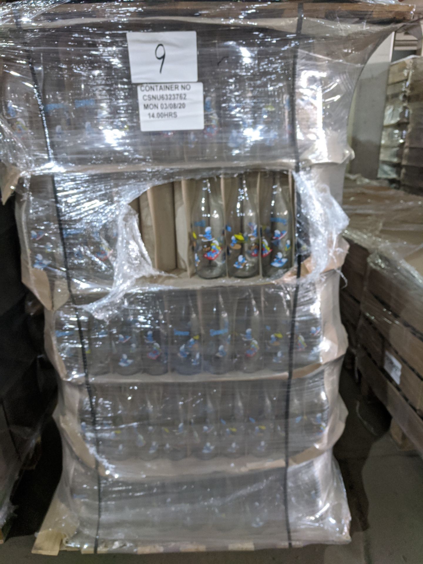 Full pallet containing appx 615 brand new 1 litre Smurf design liscensed glass bottles , new and