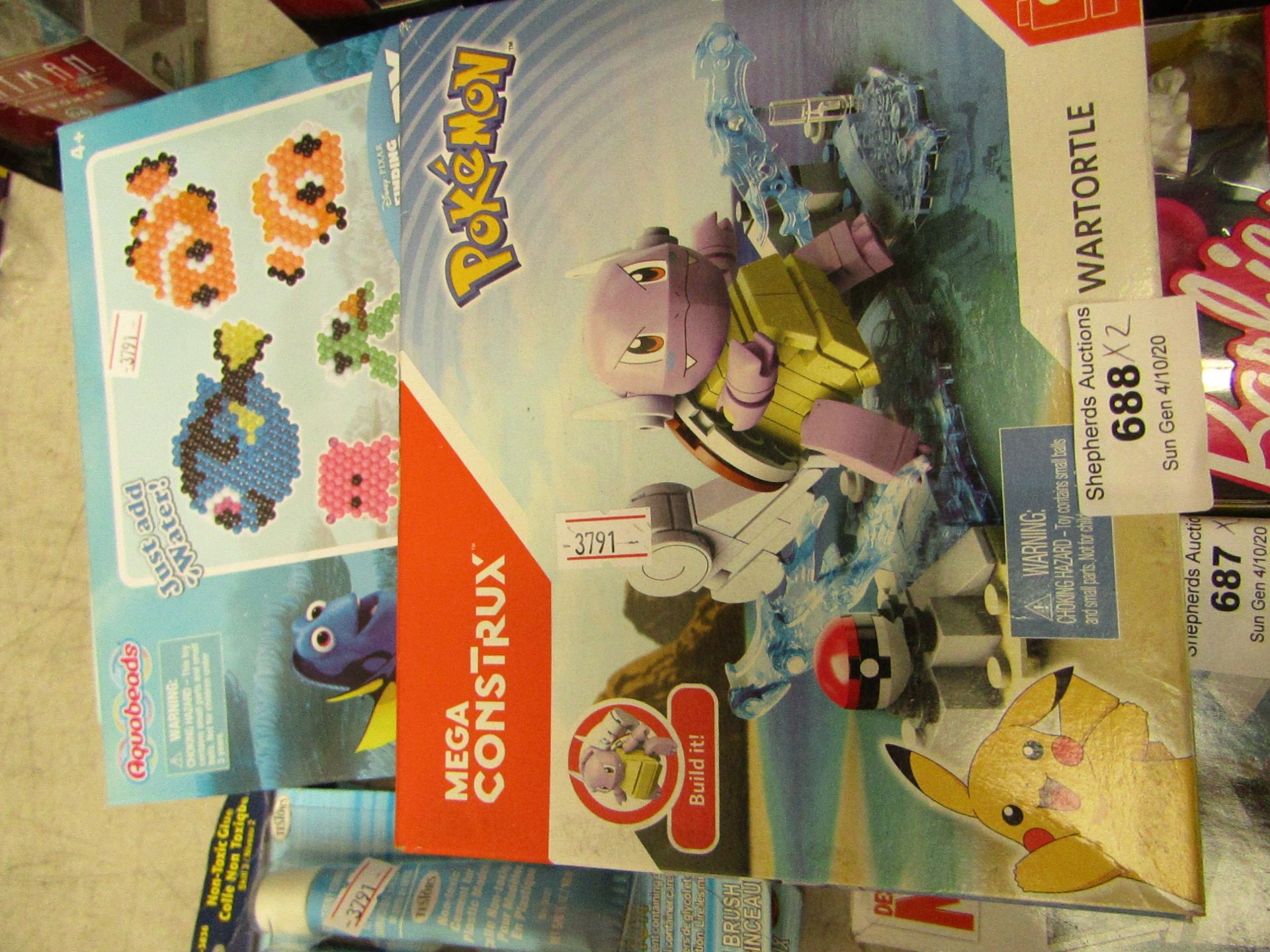 2x Items being a Mega Contrux Pokemon play set and a Finding Dory Aqua Bead play set