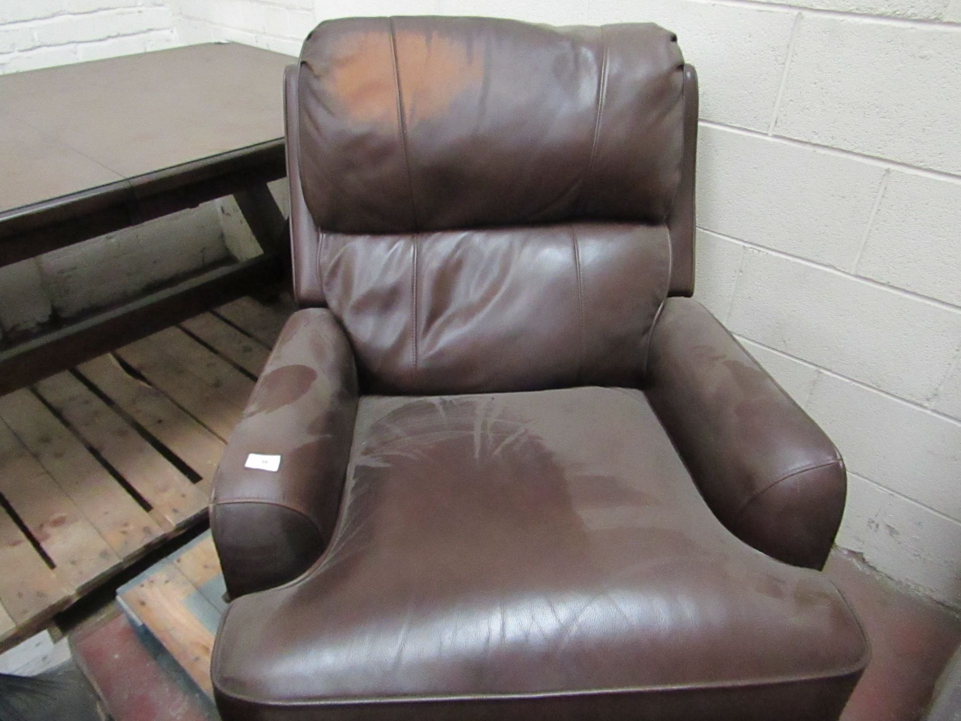 Costco Brown leather swivel reclining armchair, needs a patch recolouring on the head rest.