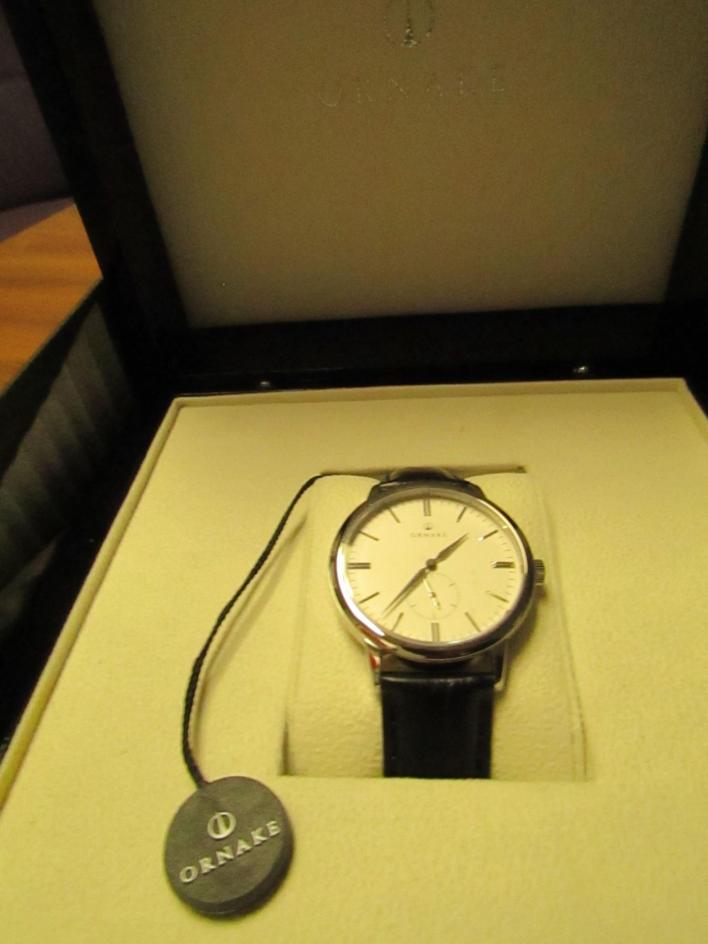 Ornake watch, miyota movement, white and silver with black leather strap, new, Boxed and ticking.