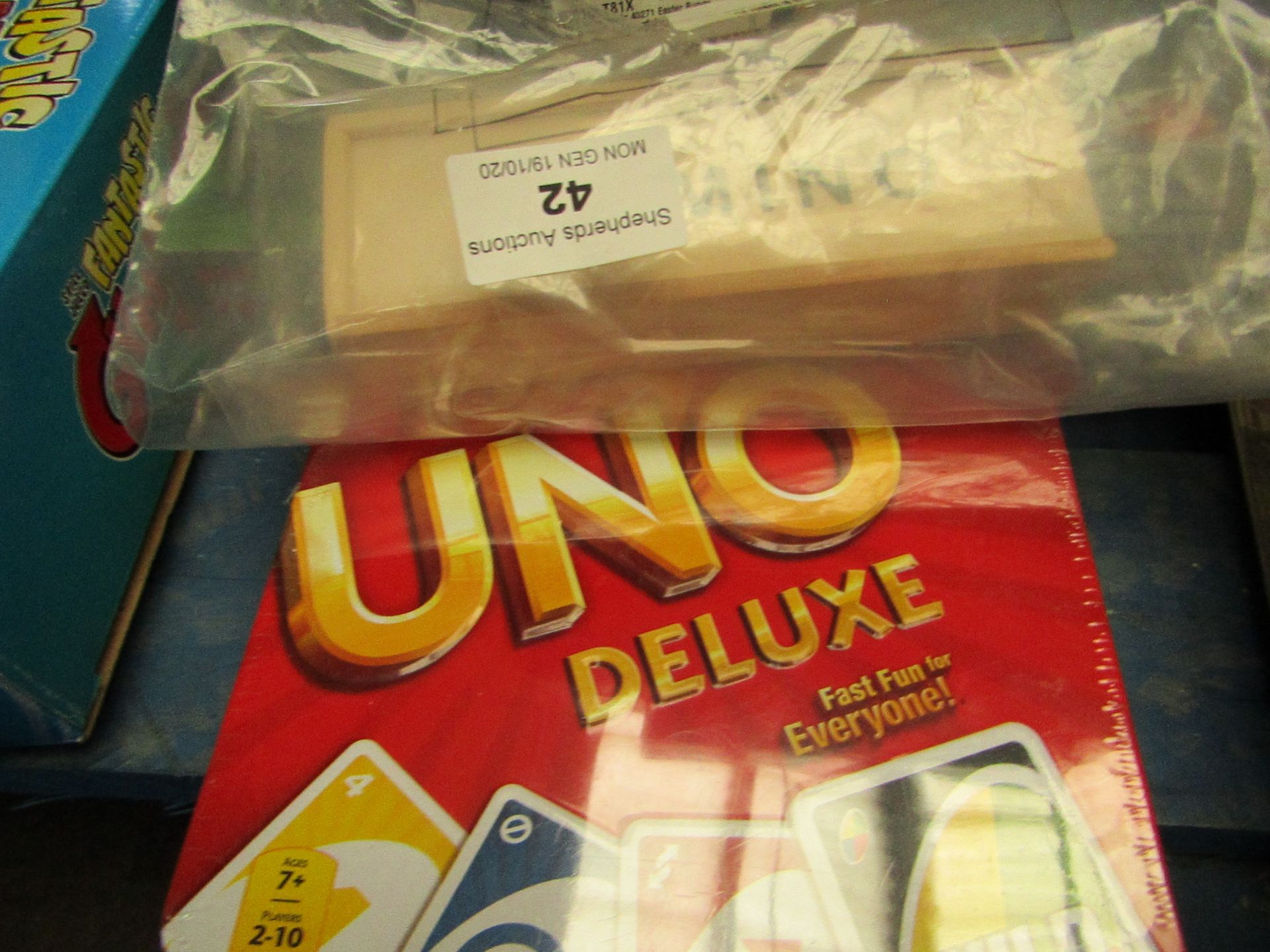 2x Various Games - 1x Uno Deluxe - Packaged. 1x Wooden Domino - Packaged.