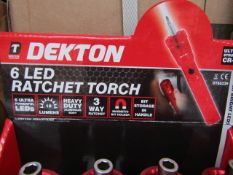 1x Dekton 6 LED ratchet torch with 6 Screw driver Bits in the base - New.