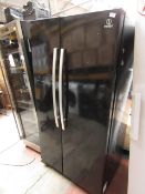 Indesit American fridge freezer, tested working for coldness but needs a clean.