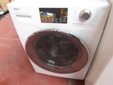Haier A+++ 1400RPM 8Kg washing machine, powers on and spins.
