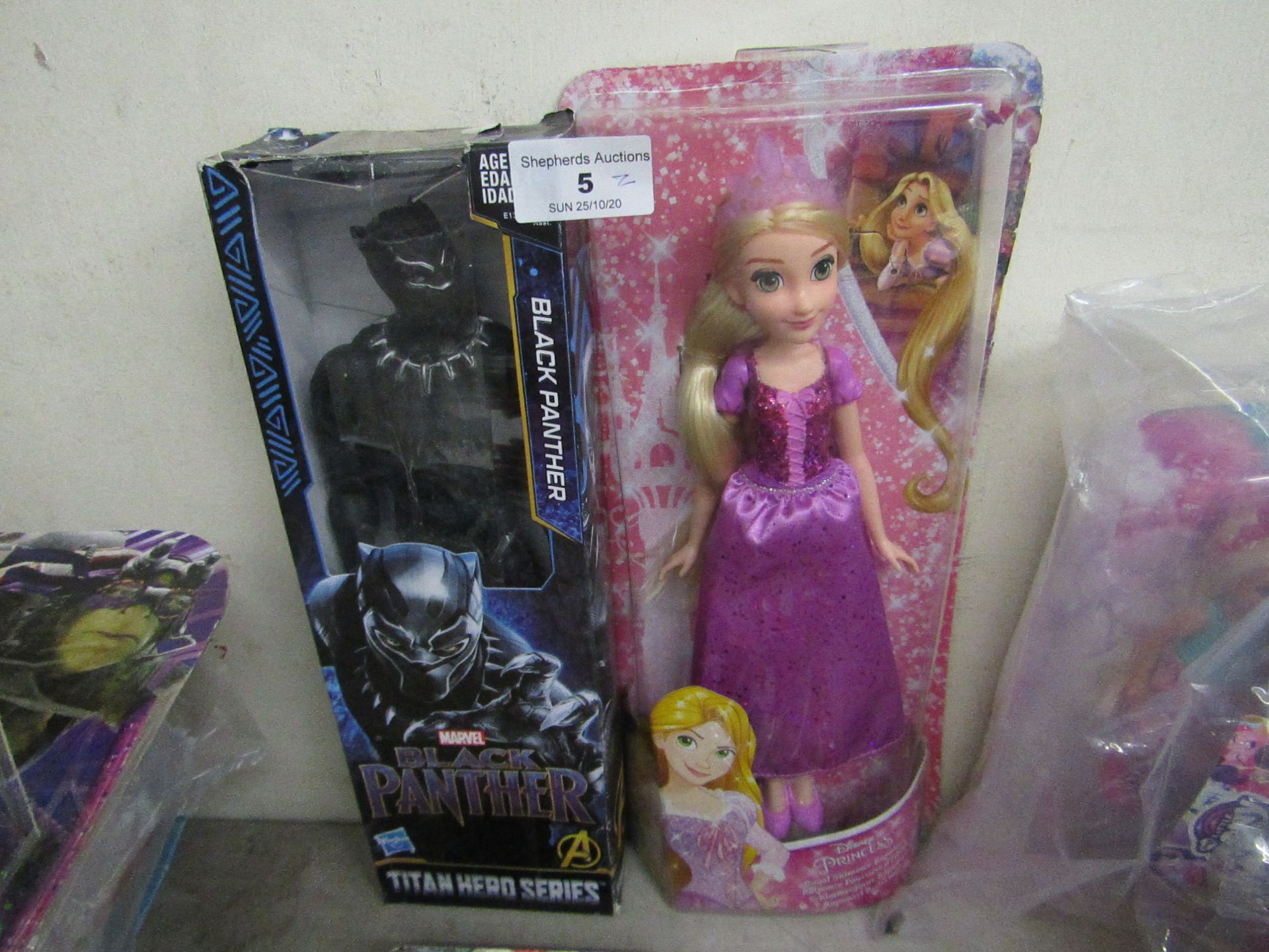 2 Items Being a Black panther Figure & a Disney Princess Fifure. Both Packaged