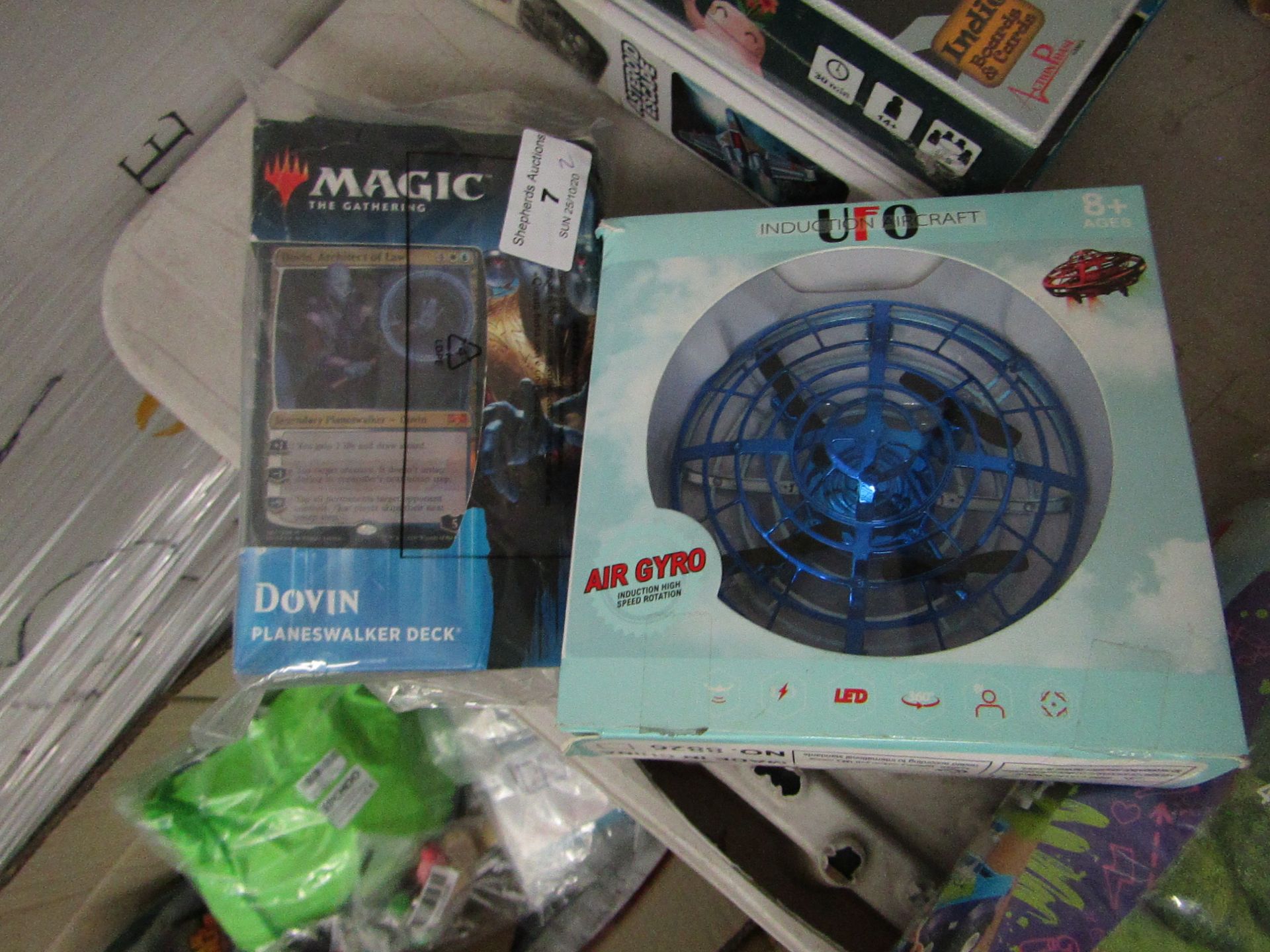 2 Items Being a UFO Air Gyro Aircraft & a Magic The Gathering Dovin Planeswalker Deck. Both look