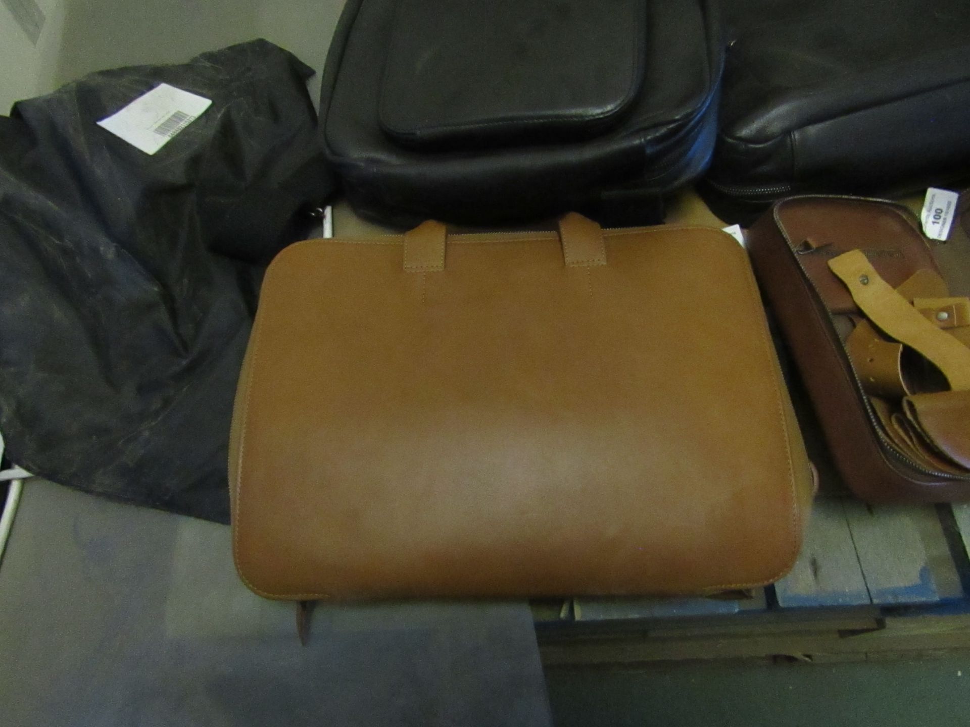 This Is Groud Leather laptop bag with shoulder strap.