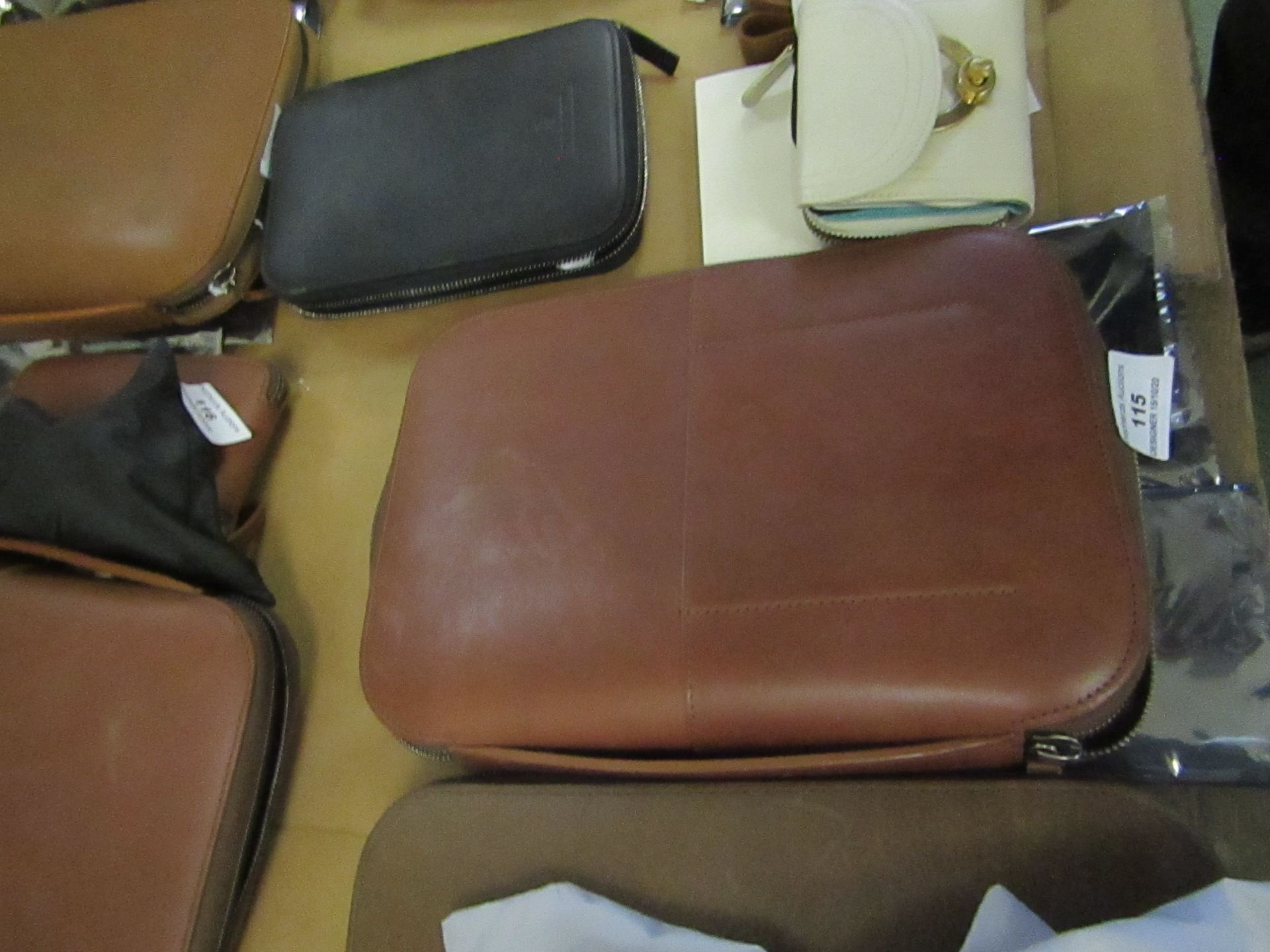 This Is Ground leather travel large tech case, looks like it holds tablets, cables headphones etc.