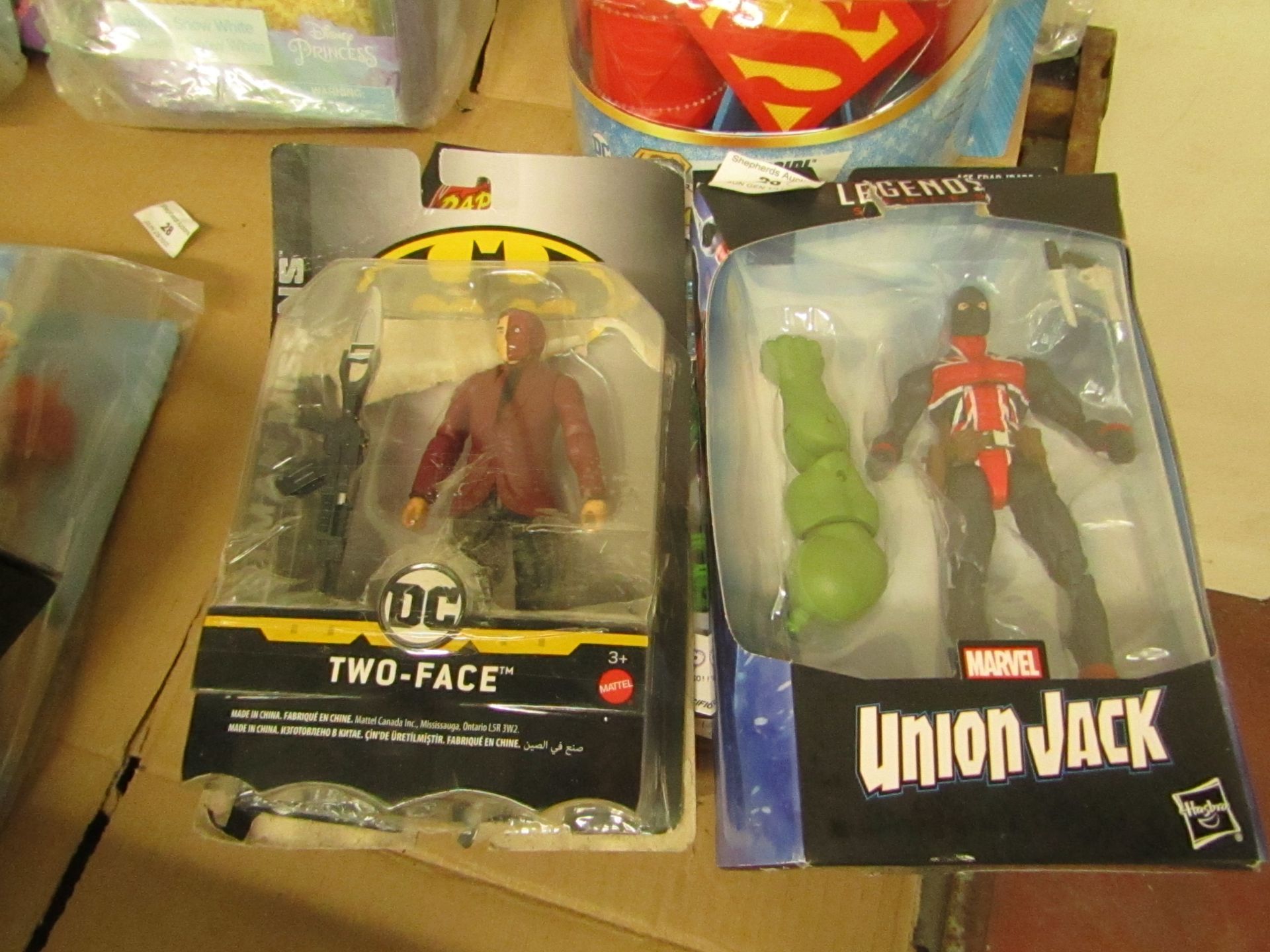 2 Items Being a Marvel union jack Figure & a DC Two Face Batman Figure. Both Unused