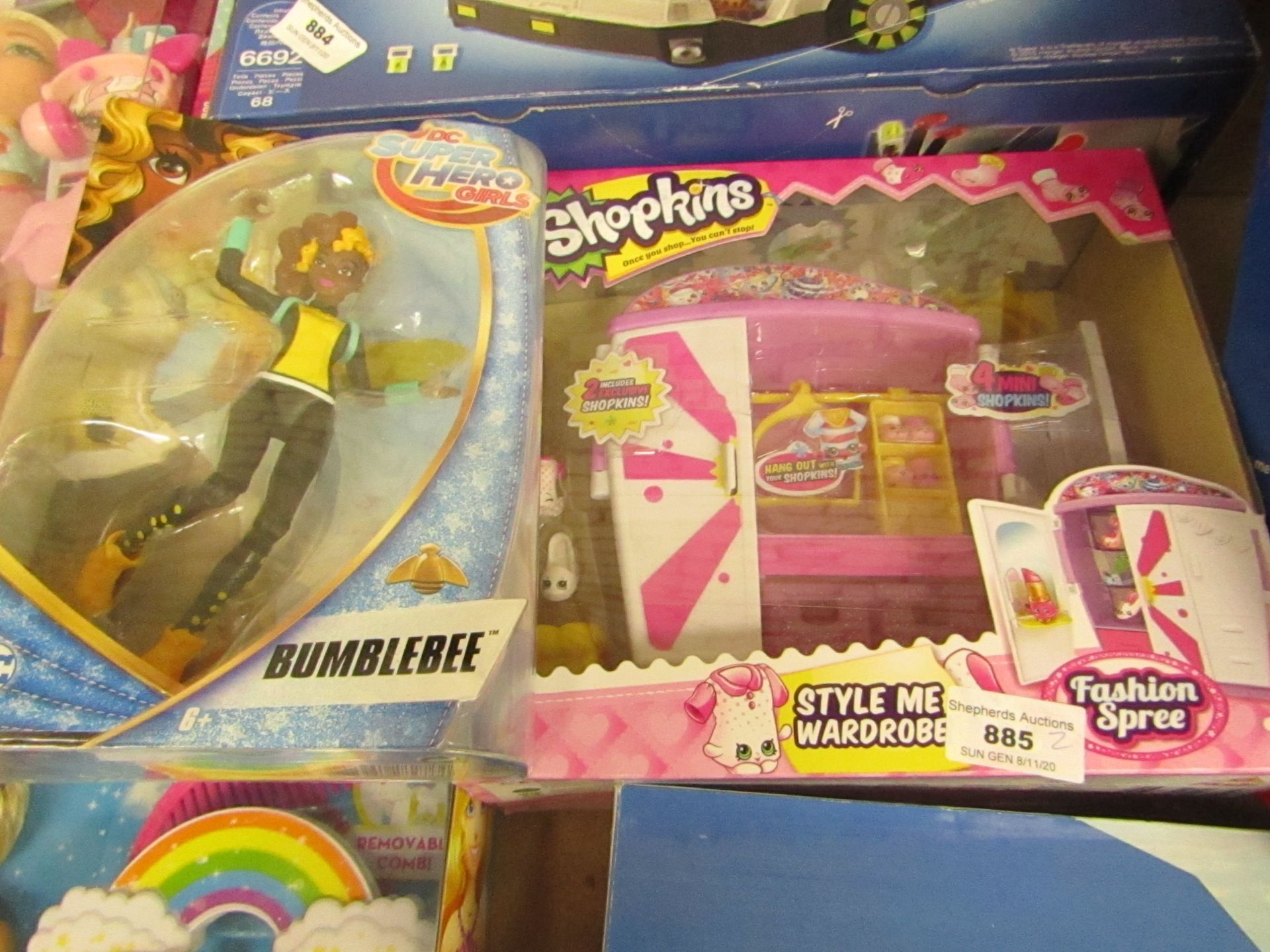 2 Items Being a Shopkins Style Me wardrobe (new) & a Super hero Girls Bumblebee Figure.