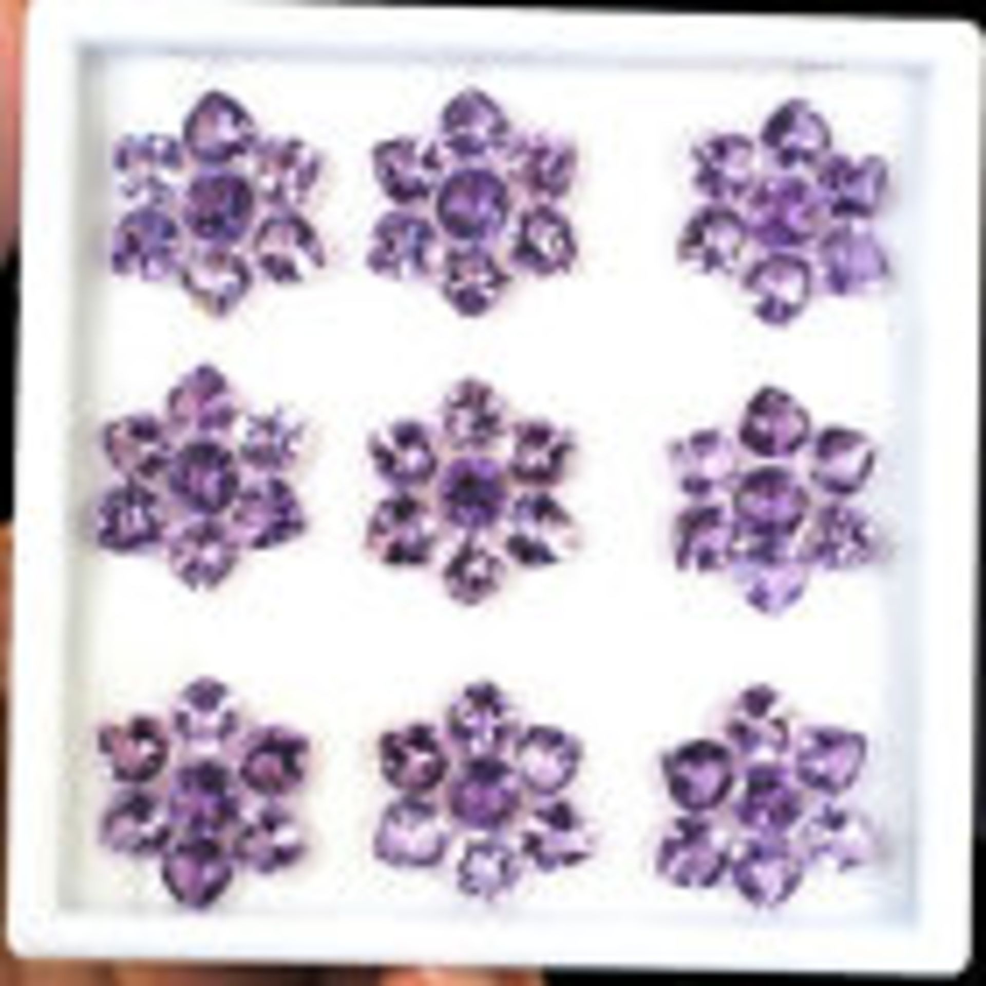 Natural Amethyst - 73.30 carats - 63 pieces - average retail value £ 4,584.49