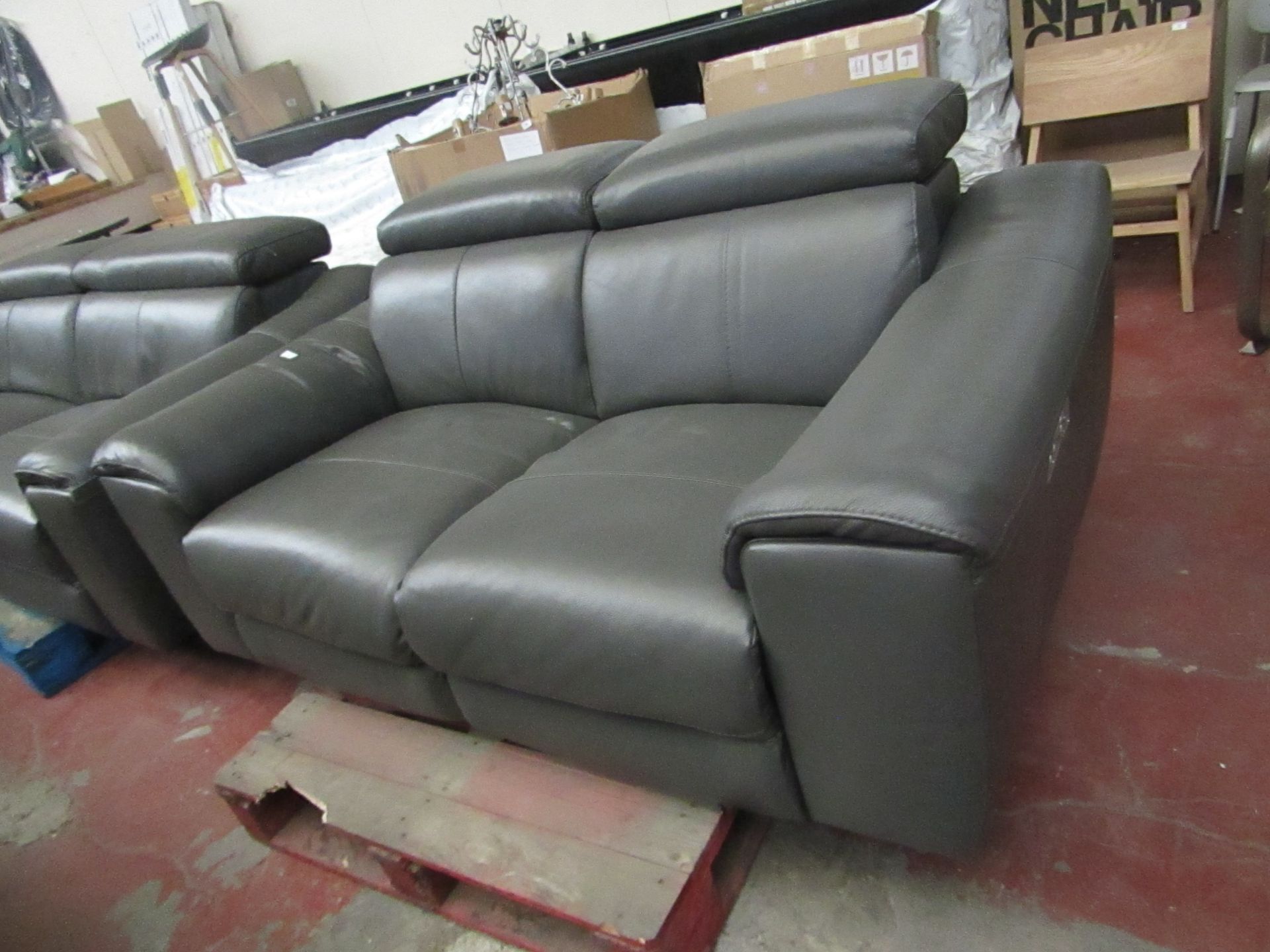 Grey Leather Italian 2 seater electric reclinig sofa, tested working and other than a quick wipe