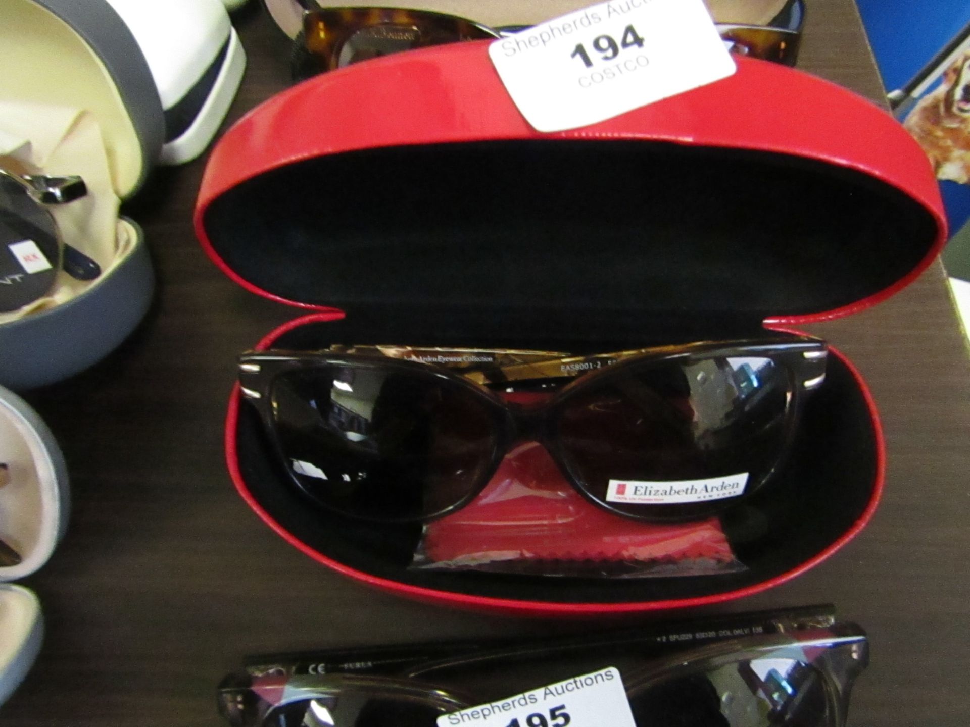 Elizabeth Arden Sunglasses with carry case, ex display