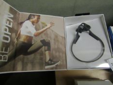 Aftershoks Trek Air wireless bone conduction earphones, boxed and unchecked.