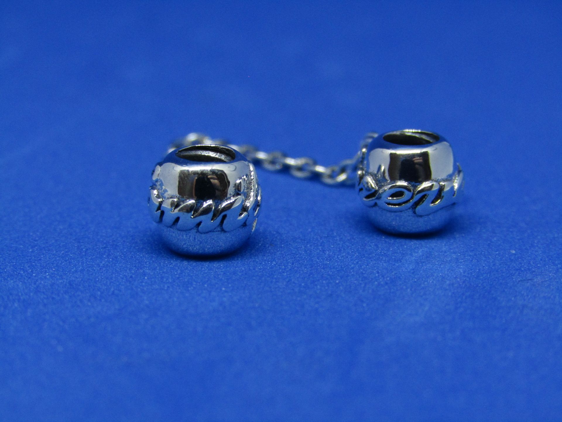 Pandora Safety chain linked charms, new with presentation bag.