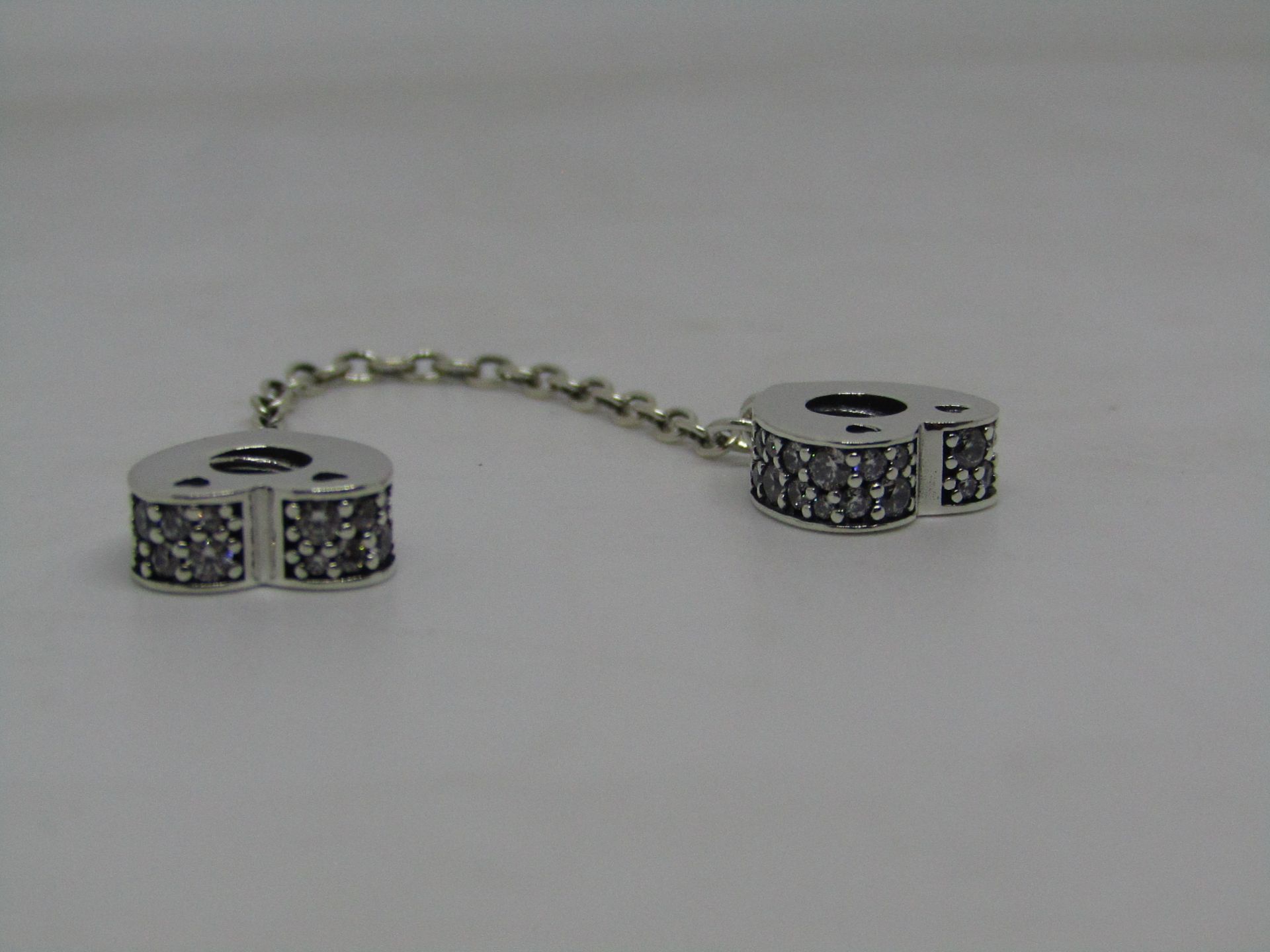 Pandora Safety chain linked charms, new with presentation bag.