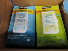 Box of Kirkland Signature Household surface wipes, the box contains 4 packs and in total across
