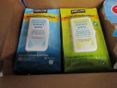 Box of Kirkland Signature Household surface wipes, the box contains 4 packs and in total across