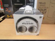 Skypods Bluetooth headphones, new and boxed.