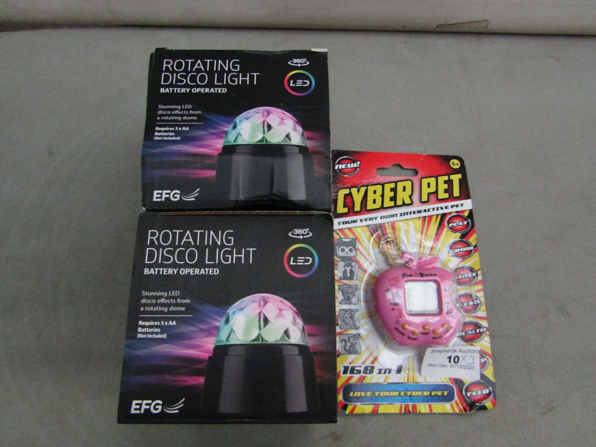 2x EFG - Rotating Disco Light (Battery Operated) - Unchecked & Boxed. 1x Cyber Pet - Keyring Pet Toy