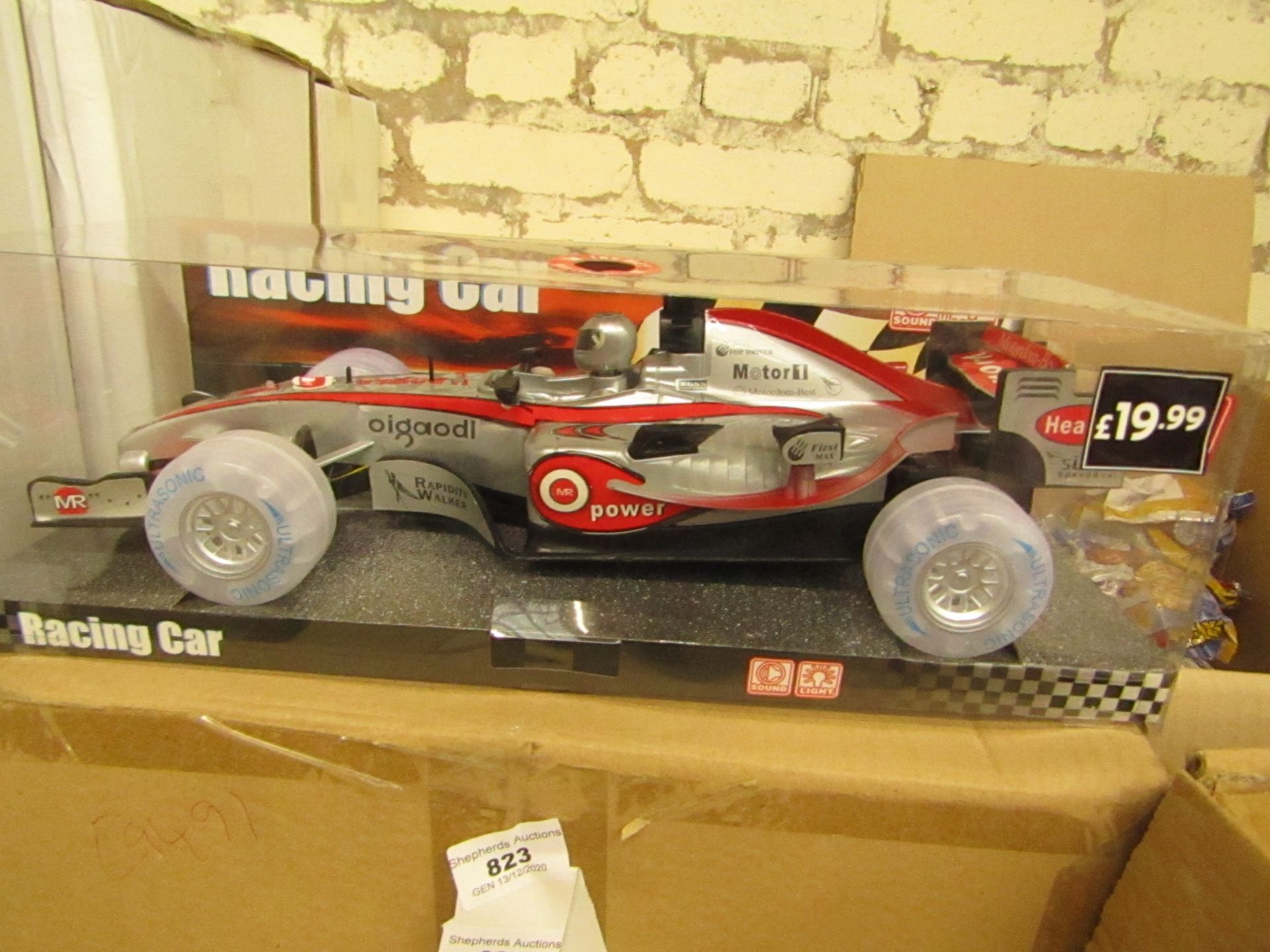 Lights and sounds Racing car, unused in packaging.