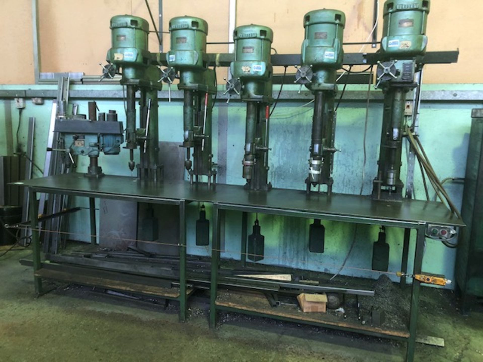 Steel drill bench with 5 Herbert and 1 Meddings overhead drill units