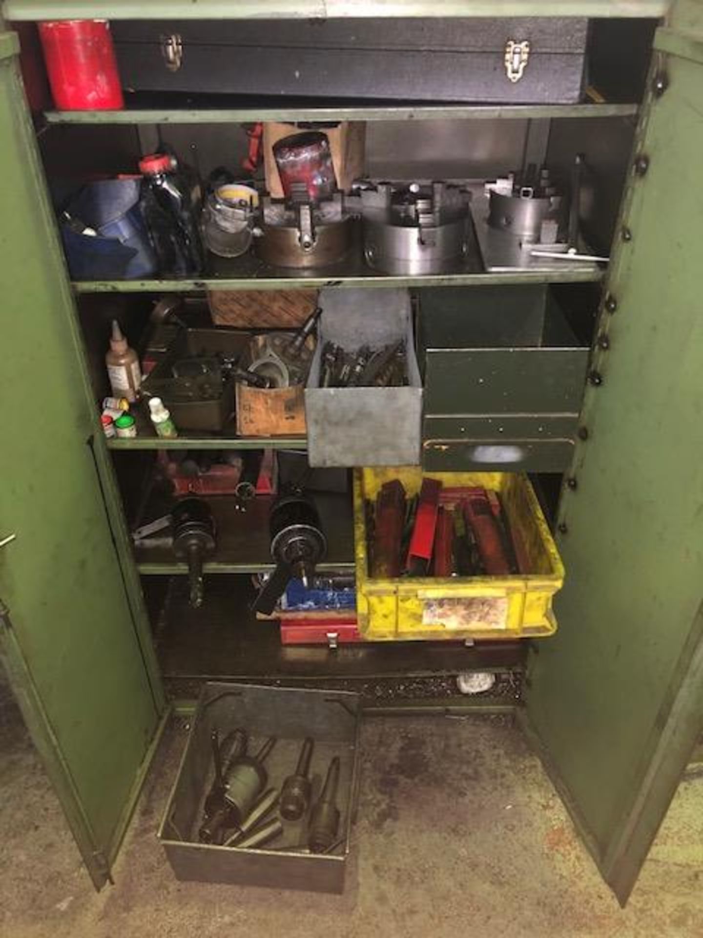 Steel cabinet including large quantity of drill bits and associated tooling