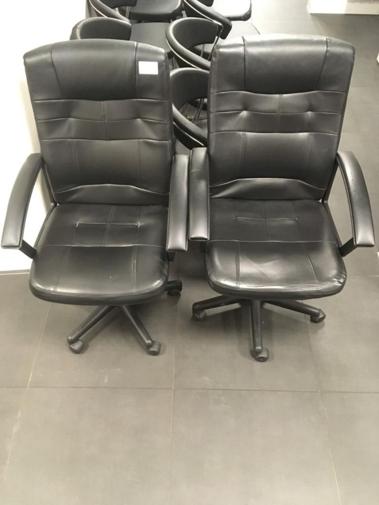 (2) Faux leather swivel chairs