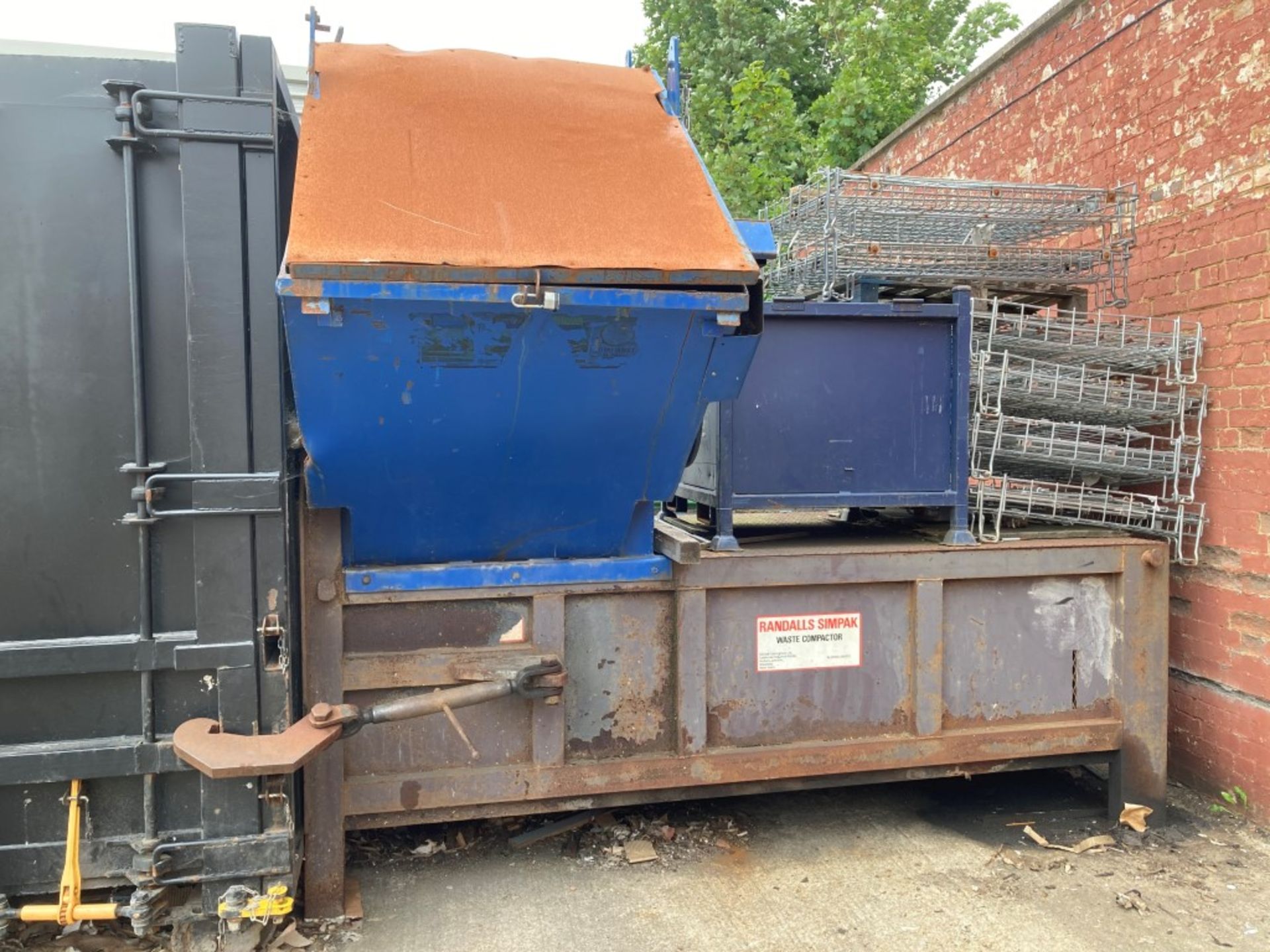 Randalls Simpak waste compactor with mounted loading skip