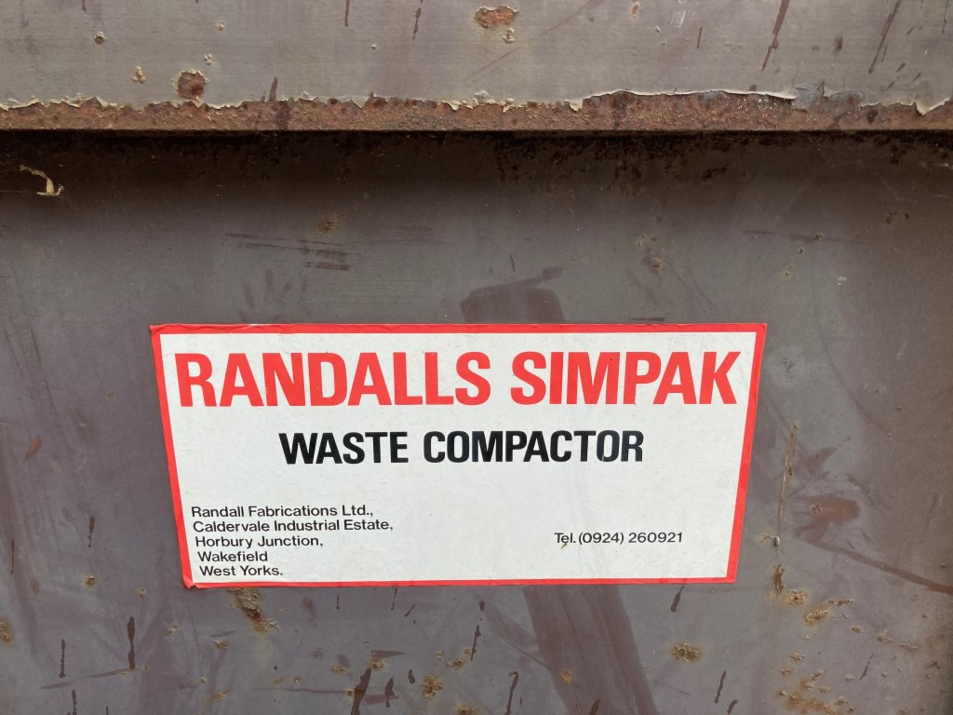 Randalls Simpak waste compactor with mounted loading skip - Image 6 of 6