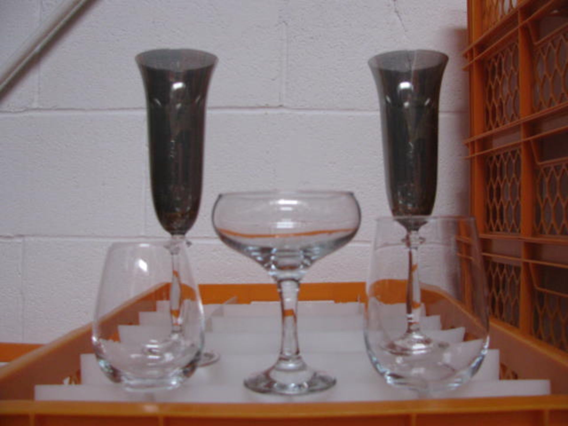 Quantity of various style champagne flutes
