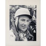 Signed and mounted photograph of Sir Stirling Moss 2/200