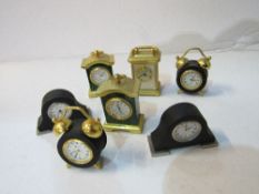 7 miniature clocks. Estimate £10-20