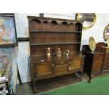 Oak dresser with 2 open shelves over 2 cupboards flanking 2 drawers & display shelf beneath.